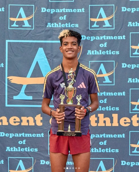 APS athlete with championship trophy at the Cheney site